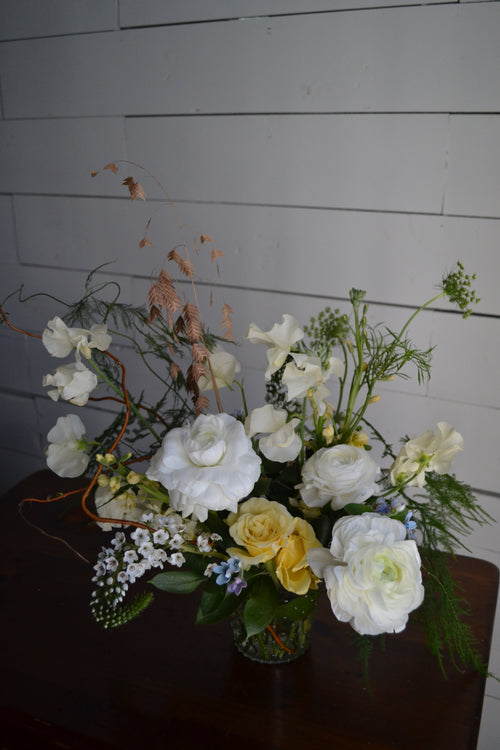 Bouquet of flowers on a wooden floor